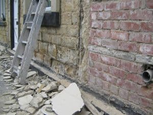 Cement render damp damage