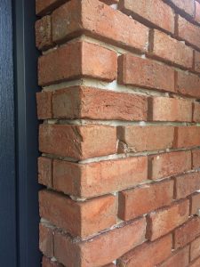 close up brick cladding before pointing