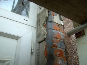 brick under cladding and render