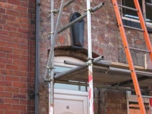 Stone cladding removed damage to brick work