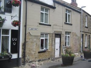 removing render from old stone cottage