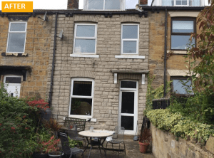 Imitation ztone cladding on a stone house