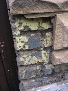 cladding stuck to painted brick