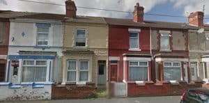 Stone cladding painted terrace houses
